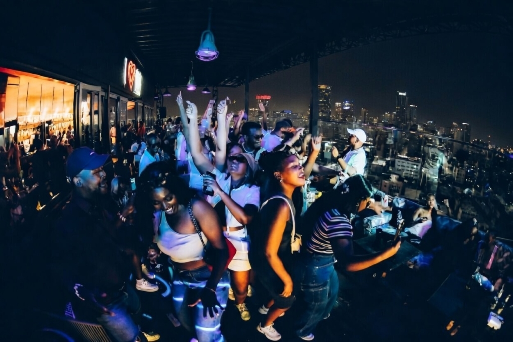 image of a roof top party night scene